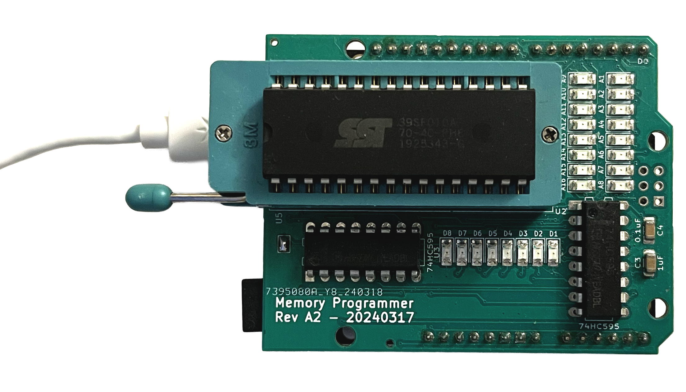 ROM Programmer with a chip inserted into it and a USB cable plugged into it